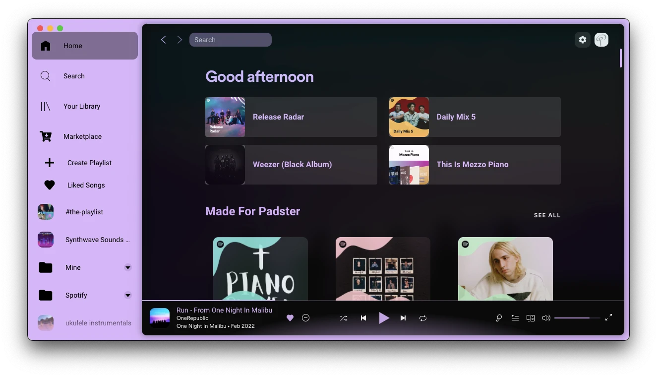 Spotify with Bloom theme — a vibrant purple and pink interface